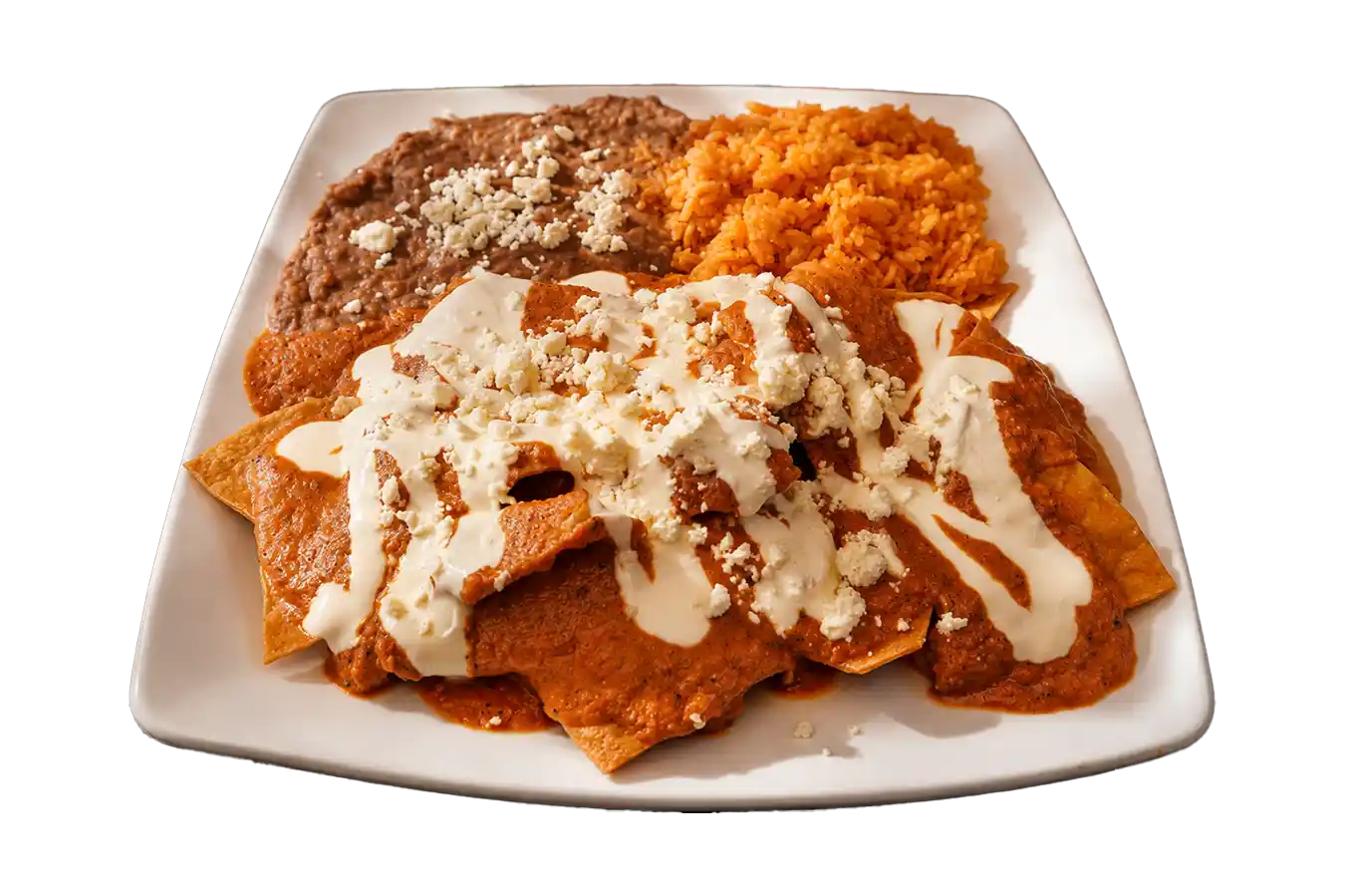 Plato de chilaquiles con huevo, arroz, frijoles y aguacate